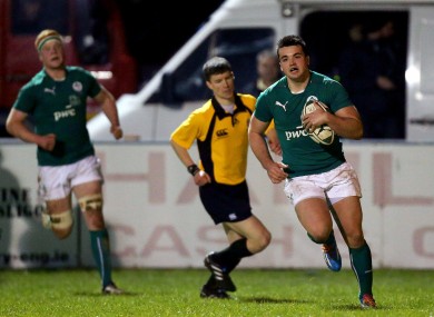 Cian Kelleher runs in Ireland's opening try.