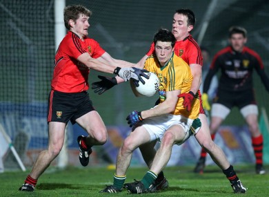 Meath's Donncha Tobin with Conor Maginn and Conor Garvey of Down.