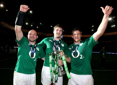 Henry, right, celebrates with Rory Best and Iain Henderson.