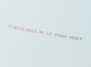 A Paddy Power banner is flown over Old Trafford.