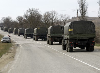 A convoy of military vehicles bearing no license plates travels on the road from Feodosia to Simferopol in the Crimea, Ukraine, today.