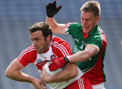 Derry's Emmet McGuckin and Kevin Keane of Mayo playing last weekend.