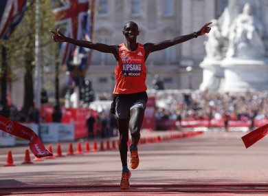 Wilson Kipsang celebrates as he crosses the line.