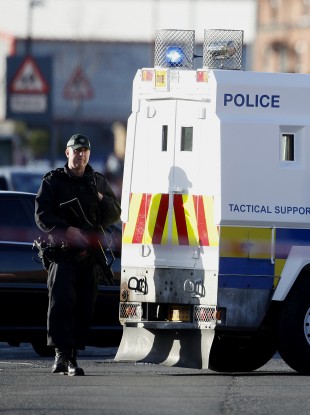 A police officer patrols the area close to where Crossan was shot dead.