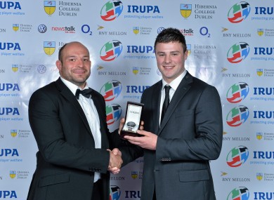 Rory Best presents Robbie Henshaw with the young player award in 2013.