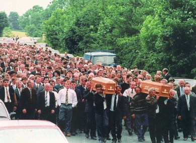 The townspeople of Loughinisland carry the coffins of 87-year-old Barney Green and his nephew Dan McCreanor -- two victims of the tragedy.