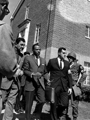 James Meredith is escorted to the University of Mississippi in 1962 as the first black student to attend.
