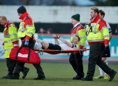 O'Donnell is stretchered off the pitch last night.