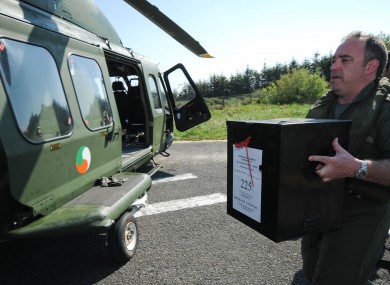 Pilot Terry Gaff loading up a ballot box after the Fiscal Treaty Referendum on Tory Island in May 2012.