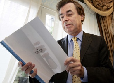 Former Justice Minister Alan Shatter reading a report - although not Guerin.