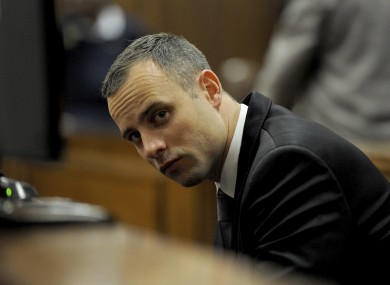 Oscar Pistorius sits in court for his ongoing murder trial in Pretoria.