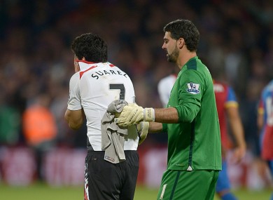 Luis Suarez and Crystal Palace goalkeeper Julian Speroni.