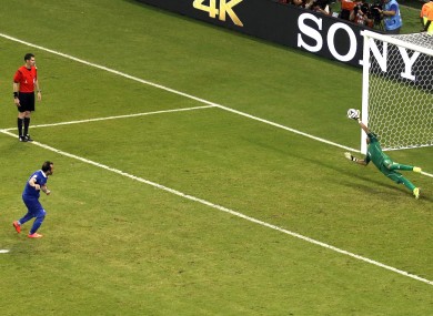 Keylor Navas makes the crucial save from Greece's Fanis Gekas.