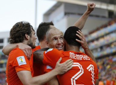 Goalscorer Memphis Depay is congratulated by Arjen Robben.