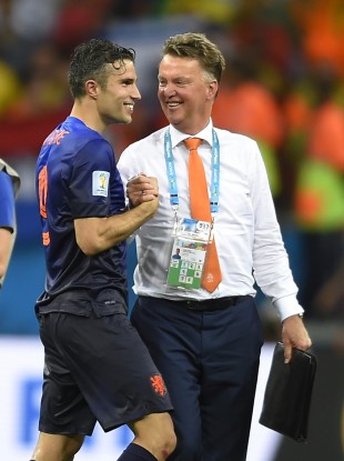 Netherlands' Robin van Persie, left, celebrates with head coach Louis van Gaal.