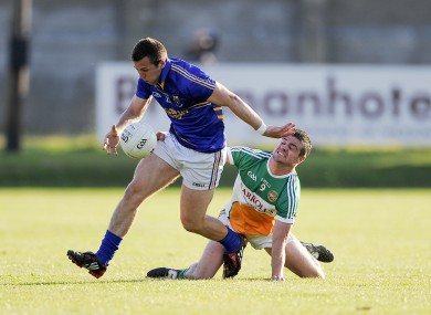 Wicklow’s Chris Murphy gets past Niall Smith of Offaly.