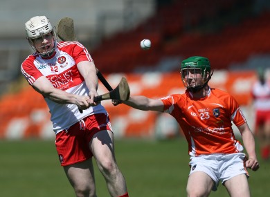 Daniel Mone with Dermot O'Neill in action in the Athletic Grounds.