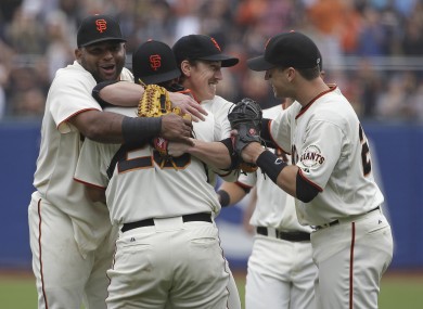 Tim Lincecum is mobbed by his Giants teammates.