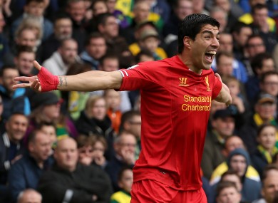 Suarez celebrates one of his 31 league goals last season.