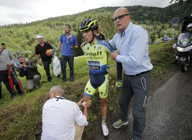 Contador receiving treatment yesterday.