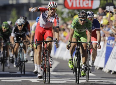 Kristoff punches the air in celebration after beating Sagan to the line.