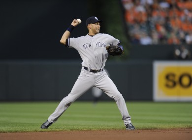 New York Yankees shortstop Derek Jeter throws to first.
