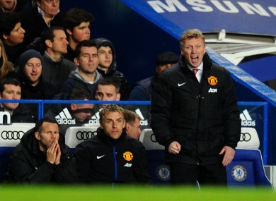 Paul Scholes (left) and Phil Neville (right) watch Salford City playing against Stalybridge Celtic.