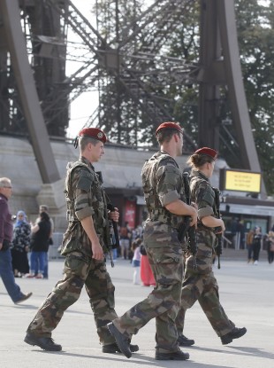 Soldiers patrol at the Eiffel Tower in Paris.