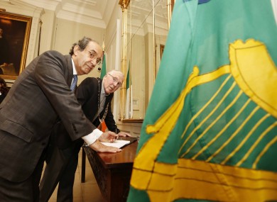 Abdelrazek signing the Book of Condolences for Gaza victims in the Mansion House.