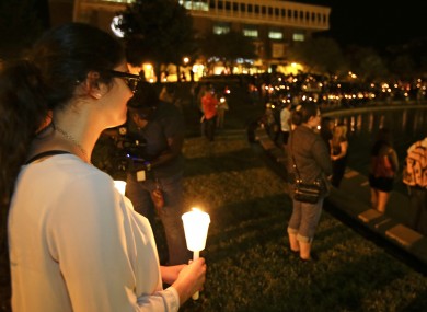 Students and supporters take part in a candle light vigil at the University of Central Florida.