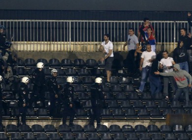 Serbian riot police officers clash with soccer fans