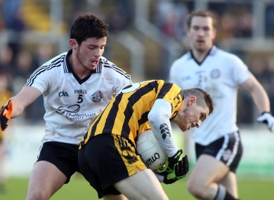 St. Eunan's Cillian Morrison and Omagh's Ciaran McLaughlin battle for possession.