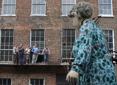 Crowds watch as performers from French arts group Royal de Luxe take to the streets of Limerick.