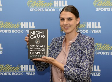 Anna Krien poses with a copy of her book