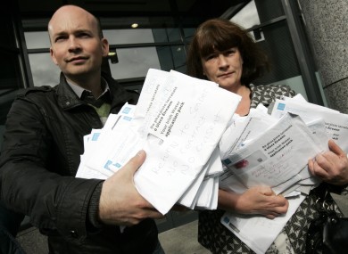 Socialist TD Paul Murphy returning unopened Irish Water registration packs to the utility.