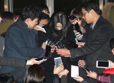 Cho Huyn-Ah, centre, surrounded by reporters before leaving for the prison today.