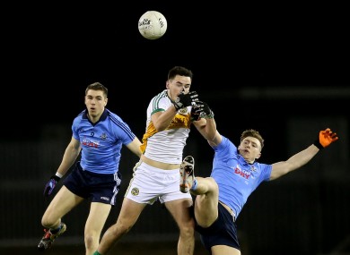 Dublin's Emmett O'Conghaile and John Small with Offaly's Eoin Carroll.
