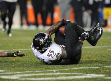 Terrell Suggs intercepts the ball with his knees on a crucial play last night.