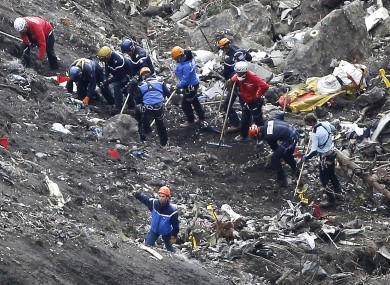 Rescue workers sift through the debris after the Germanwings disaster in the French Alps last week.