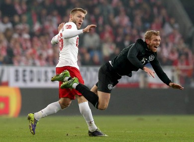 Jakub Blaszczykowski fouls Paul Green during a friendly in 2013.