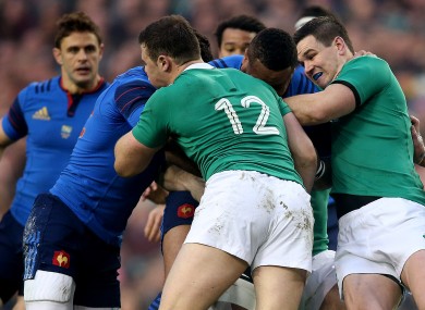 Johnny Sexton and Robbie Henshaw attempt to tackle Mathieu Bastareaud.
