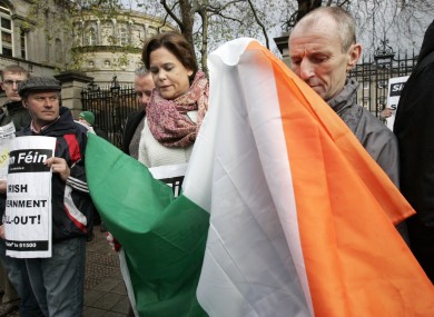 Does this constitute 'throwing around' the flag? Mary Lou McDonald at a Dáil protest in 2010.