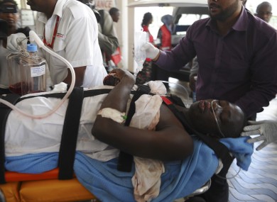 Medics help an injured person at Kenyatta national Hospital in Nairobi last Thursday
