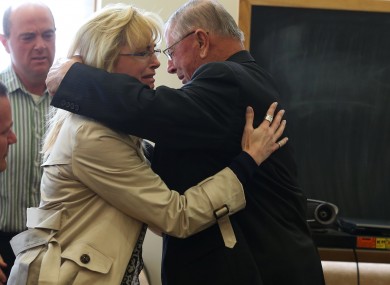 Henry Rayhons hugs members of his family after being found not guilty.