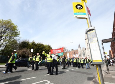Dublin Bus and Bus Eireann workers march towards the Dail.