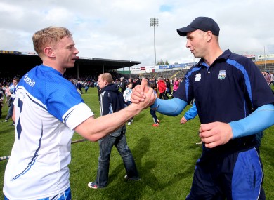 Philip Mahony celebrates Waterford's league title win with selector Dan Shanahan.