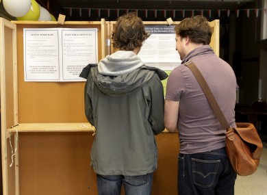 Voting for the Referendums on Marriage Equality and Age of Eligibility to the Office of President are Andrew McCullagh, left, and his partner Oisin O'Reilly,