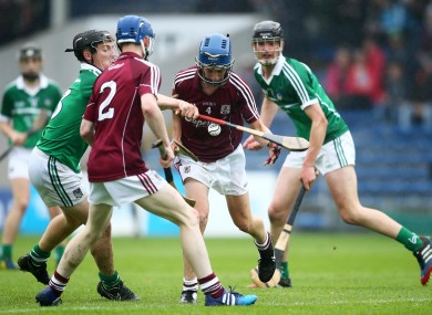 Galway and Limerick players battle it out for possession.