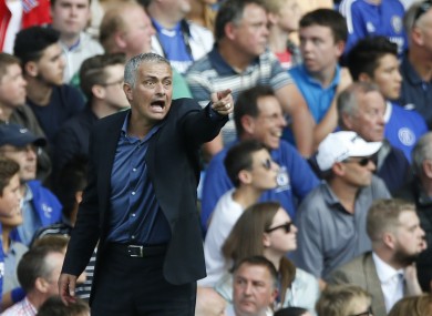 Chelsea manager Jose Mourinho points to his players as he watches his side from the touchline during the English Premier League match between Chelsea and Arsenal.