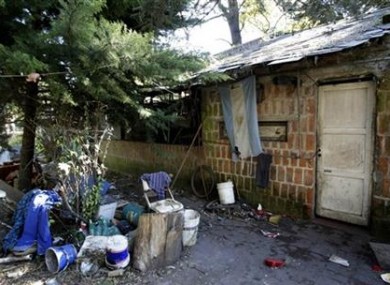 An Argentine flag hangs from the home where Eduardo Oviedo isaccused of keeping his wife and son.